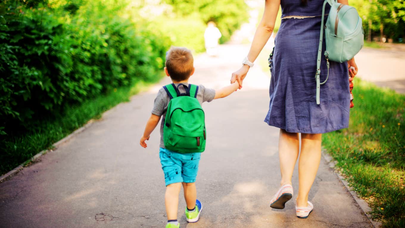 Mother With out A Car Had To Stand In The Automotive Line Holding Her Child To Drop Him Off At Daycare